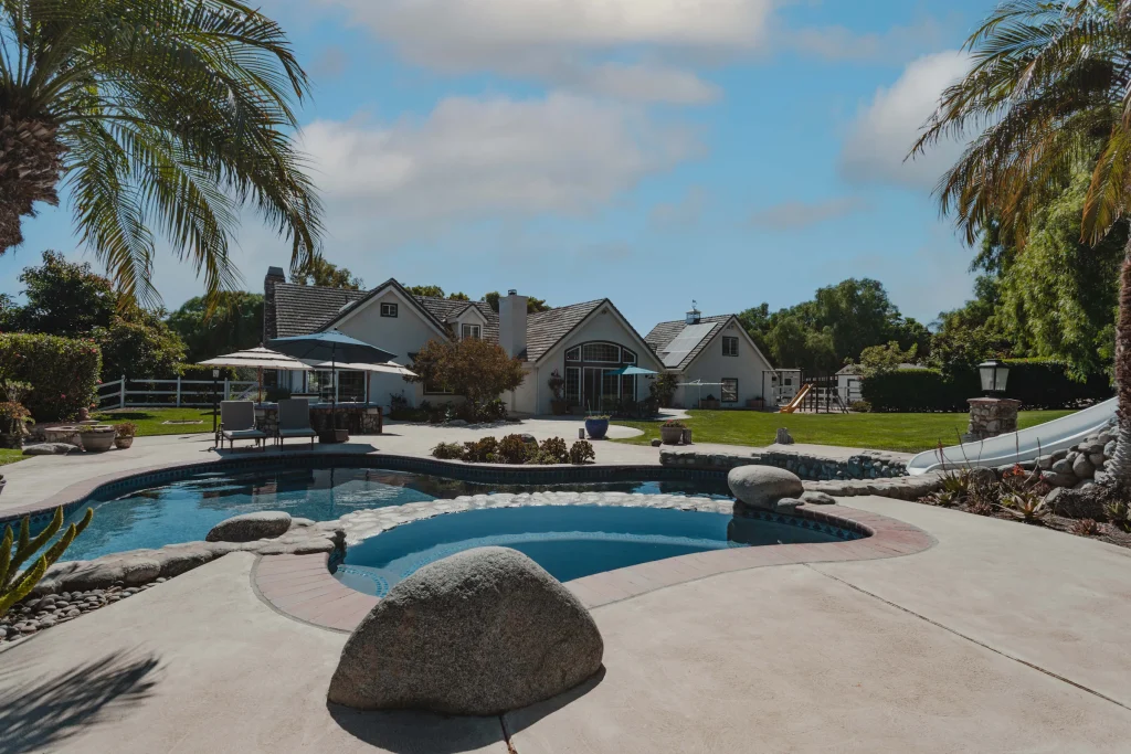 Southern California backyard with a pool, palms and landscaping