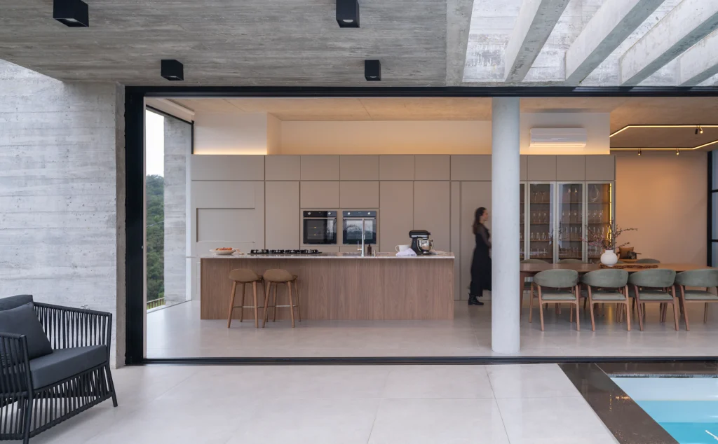Kitchen and dining area opening onto outdoor seating