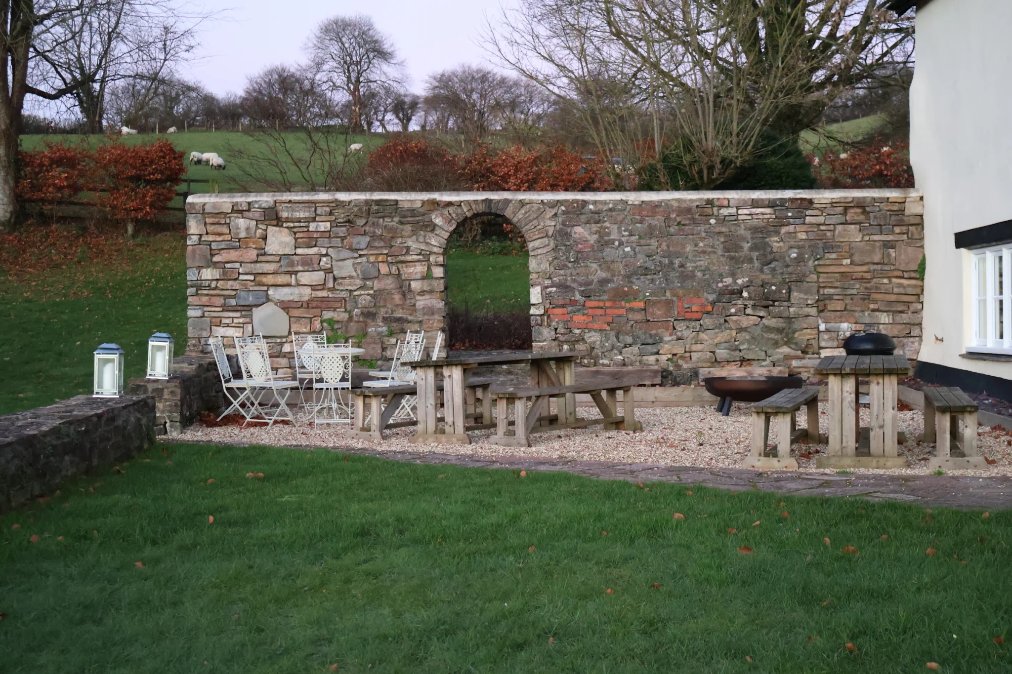 Patio with a stone wall and outdoor furniture